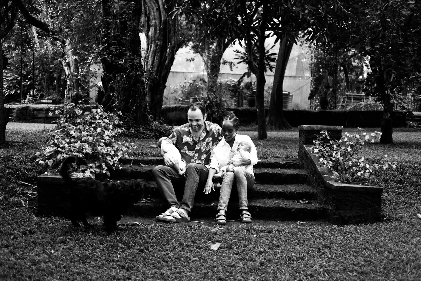 Family relaxing together on garden steps